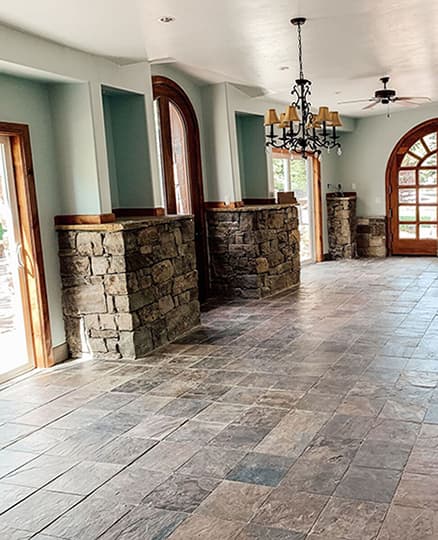 Empty dining room with outdated patio doors.