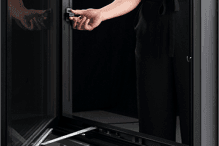 Pella's Easy Slide Operator is demonstrated on a black casement window.