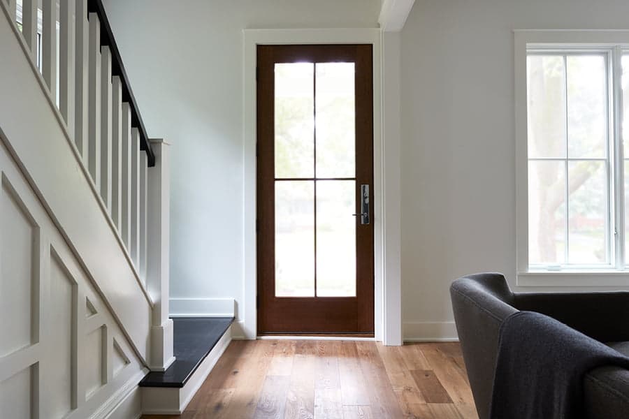 Interior of home with wood glass paneled front door