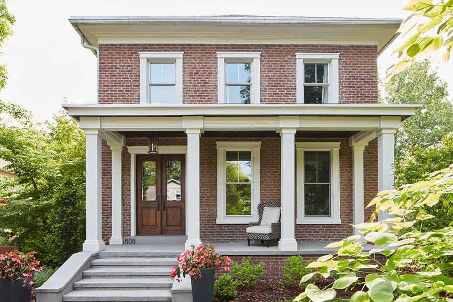 Two Story Traditional Colonial Home with Wood Entry Door