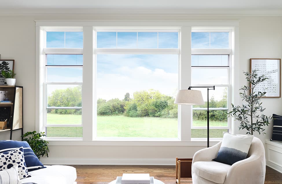 a fixed window flanked by two double-hung windows with the hidden screen feature