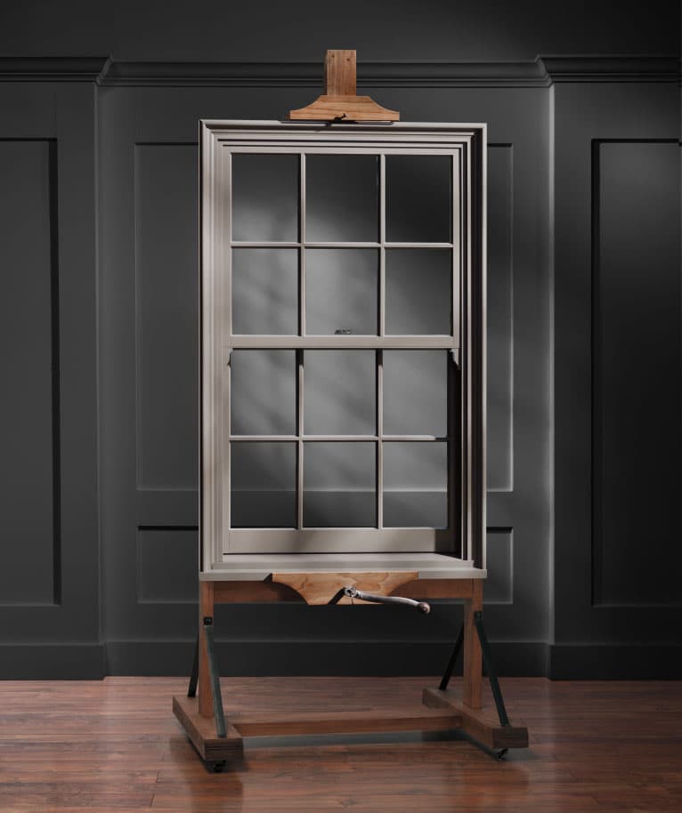 a single pella reserve double-hung window on a display stand