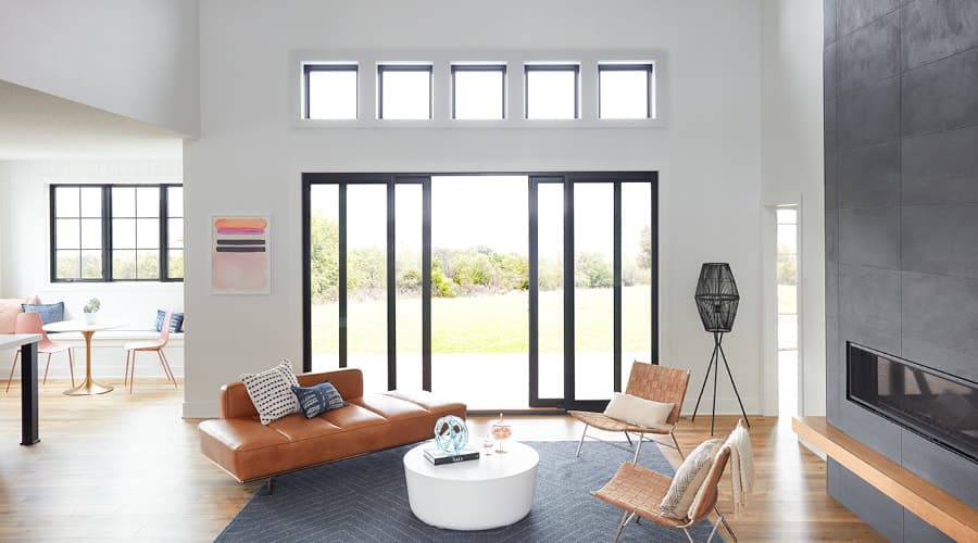 Sliding black French doors in clean, modern living room