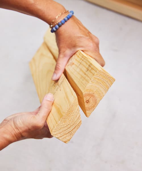 two boards have been cut so that the edges fit together in 45 degree angles.