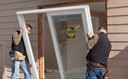 two men installing a sliding patio door