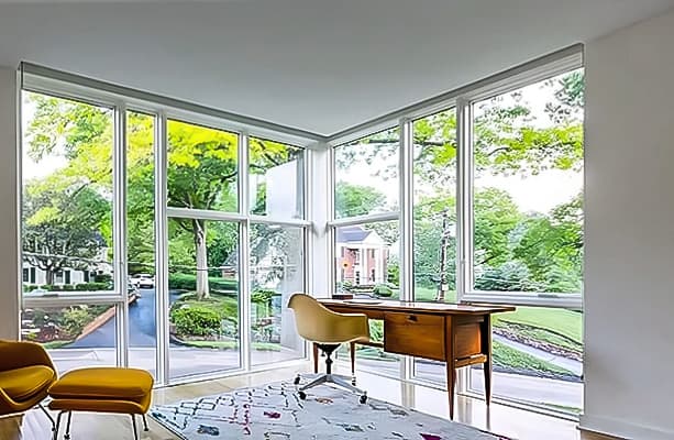 Custom Window Wall for Modern Home Office Home office with two walls of glass made from a combination of white fixed windows